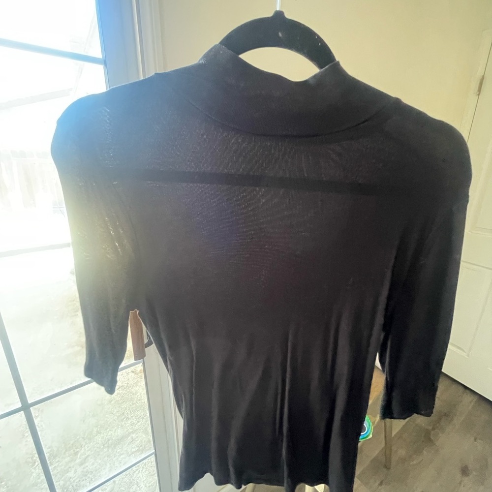 Black fitted turtle neck with 3/4 sleeve